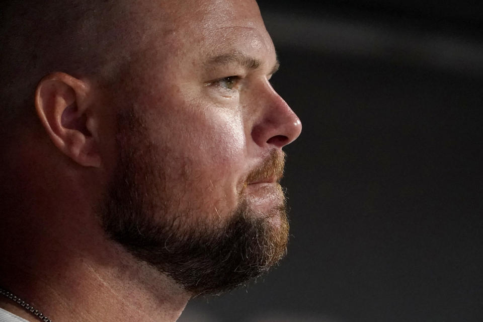 St. Louis Cardinals starting pitcher Jon Lester stands in the dugout during the eighth inning of a baseball game against the Cincinnati Reds Friday, Sept. 10, 2021, in St. Louis. (AP Photo/Jeff Roberson)