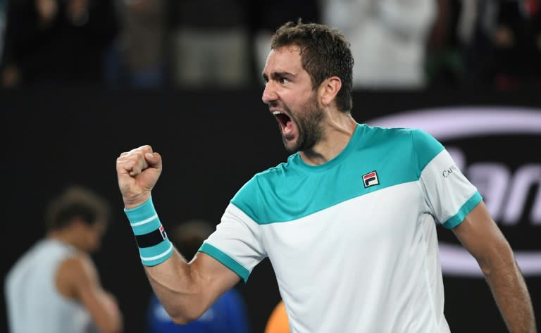 Croatia's Marin Cilic celebrates after his victory over Spain's Rafael Nadal in their men's singles quarter-finals match at the Australian Open in Melbourne