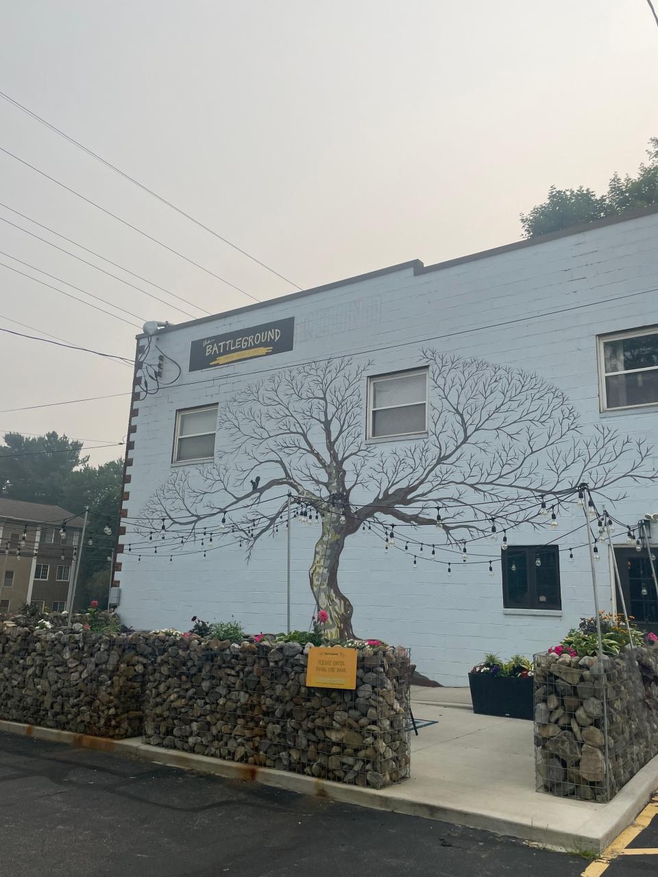 A large painting of a tree garnishes the restaurant's white brick building in Kent.