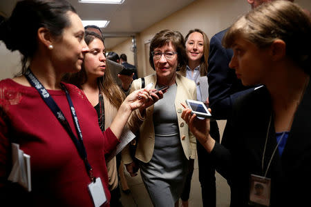 U.S. Senator Susan Collins (R-ME) talks to reporters as she arrives for the weekly Republican party caucus luncheon at the U.S. Capitol in Washington, U.S. October 31, 2017. REUTERS/Jonathan Ernst