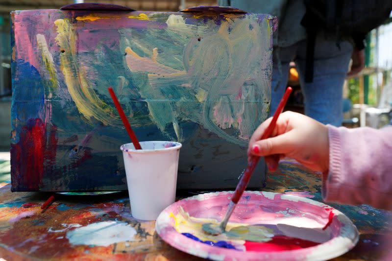 Girl paints at her kindergarten in Jerusalem