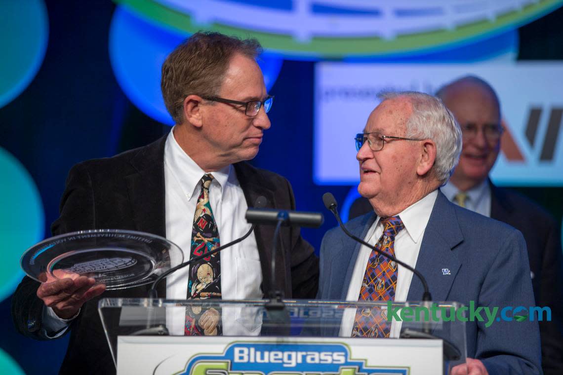 Doug Flynn, left, presented his father, Bobby Flynn, with a new award for volunteers during a Bluegrass Sports Awards banquet.