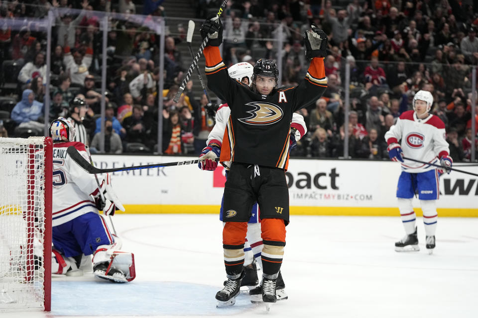 Anaheim Ducks right wing Troy Terry, center, celebrates a goal by center Mason McTavish as Montreal Canadiens goaltender Sam Montembeault, left, sits in goal during the third period of an NHL hockey game Friday, March 3, 2023, in Anaheim, Calif. (AP Photo/Mark J. Terrill)