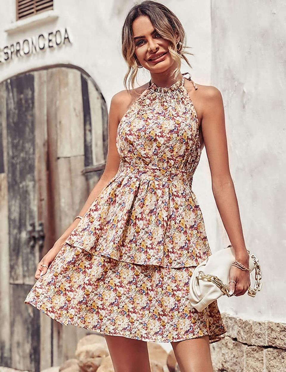 <p>The <span>PrettyGarden Summer Boho Floral Sundress Halter Neck Tiered Ruffle Mini Swing Dress </span> ($33, originally $41) is a stunning floral minidress that's perfect for summer vacations and brunches with your besties. It has a tie halterneck and an elastic waist for a flattering silhouette. It comes in a variety of floral designs and colors.</p>