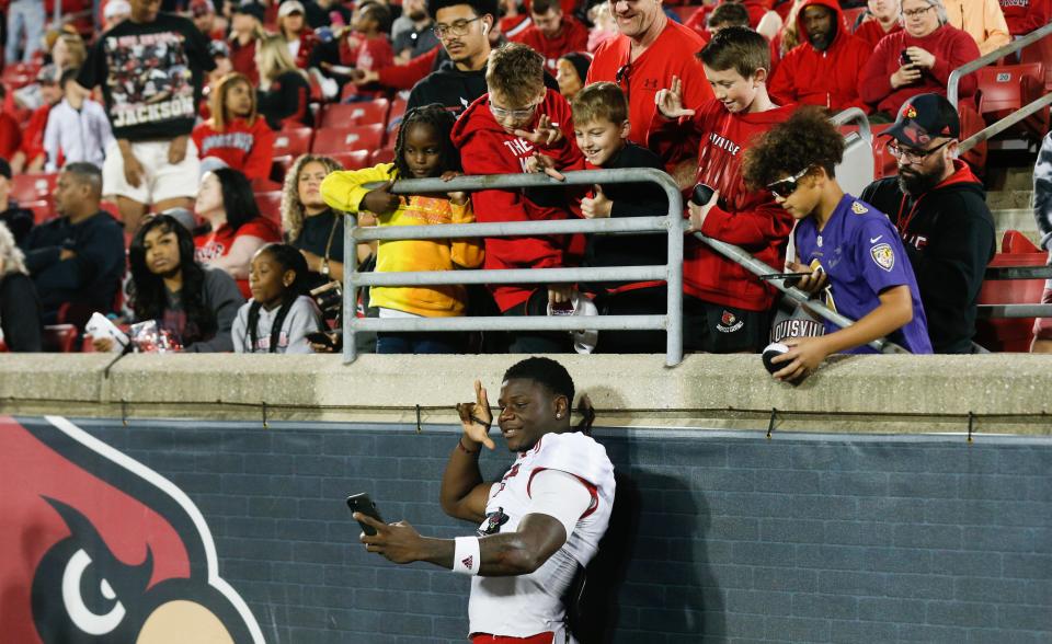 Louisville’s Chris Bell interacts with fans during the team's spring game April 19 at L&N Stadium.