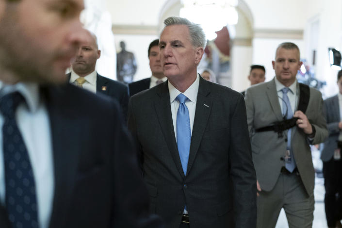 Speaker of the House Kevin McCarthy, R-Calif., talks to reporters as he walks to the speaker's ceremonial office at the Capitol in Washington, Monday, Jan. 9, 2023. (AP Photo/Jose Luis Magana)