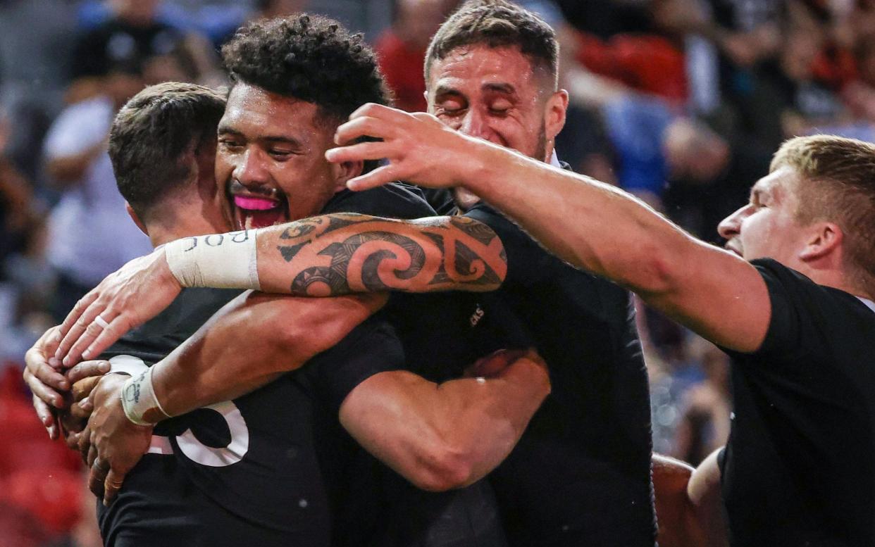 New Zealand's Will Jordan (left) celebrates with his team-mates after scoring a try - AFP