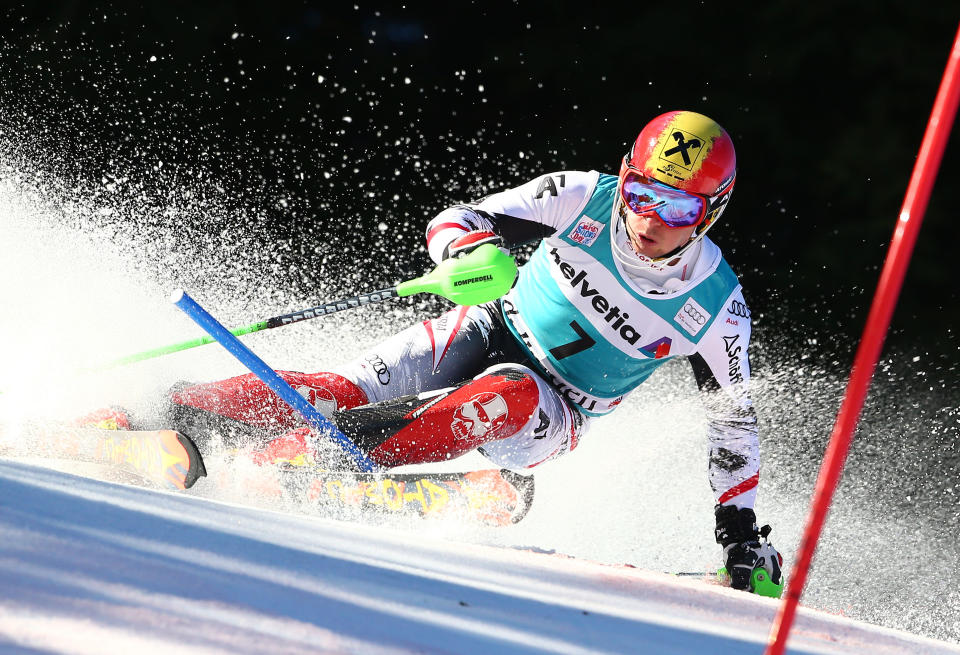 Austria's Marcel Hirscher speeds down the course to clock the third fastest time during the first run of an alpine ski men's World Cup slalom in Adelboden, Switzerland, Sunday, Jan. 12, 2014. (AP Photo/Giovanni Auletta)