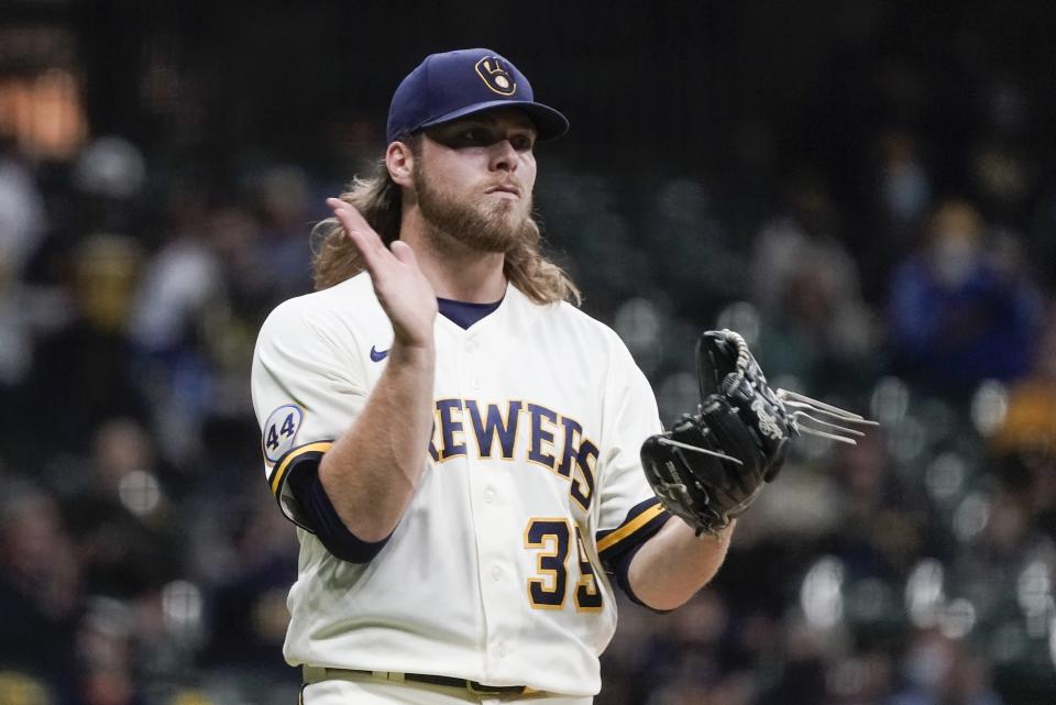 Milwaukee Brewers' Corbin Burnes reacts after getting Miami Marlins' Sandy Leon to strike out during the fifth inning of a baseball game Monday, April 26, 2021, in Milwaukee. (AP Photo/Morry Gash)