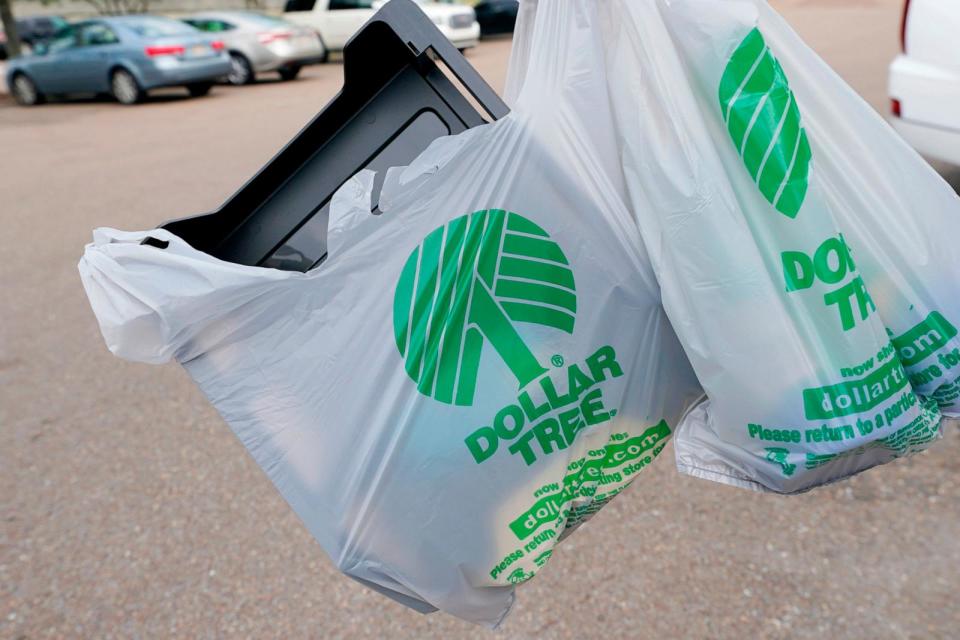 PHOTO: A customer exits a Dollar Tree store holding a shopping bag, May 11, 2022, in Jackson, Miss. (Rogelio V. Solis/AP)