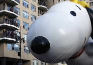 The Snoopy and Woodstock balloon floats down Central Park West during the 87th Macy's Thanksgiving Day Parade in New York November 28, 2013. REUTERS/Gary Hershorn (UNITED STATES - Tags: ENTERTAINMENT SOCIETY BUSINESS)