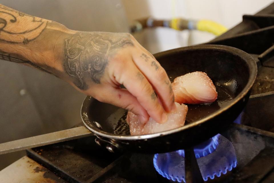 Executive Chef of the Drayton Hotel Benjamin Murray cooks some snapper at the St. Neo's Brasserie in the Drayton Hotel in Savannah, GA Saturday, May 28, 2022.