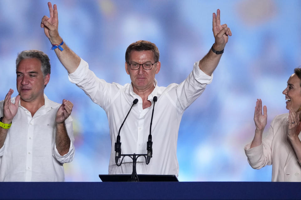 Alberto Feijoo, leader of the mainstream conservative Popular Party, gestures to supporters outside the party headquarters following Spain's general election, in Madrid, Monday, July 24, 2023. Spain's conservative Popular Party is set to narrowly win the country's national election but without the majority needed to topple the coalition government of Socialist Prime Minister Pedro Sánchez. (AP Photo/Manu Fernandez)