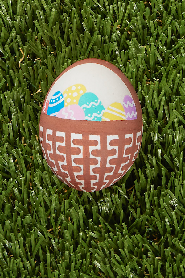 <p>Here’s a project for a steady hand: Use fine-tipped paint pens or brushes in brown to paint a wicker basket onto your egg. Fill that basket with teeny painted eggs. So pretty. And so meta!</p>