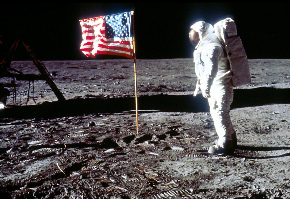 Buzz Aldrin poses next to the U.S. flag July 20, 1969 on the moon during the Apollo 11 mission. (Photo by NASA/Liaison)
