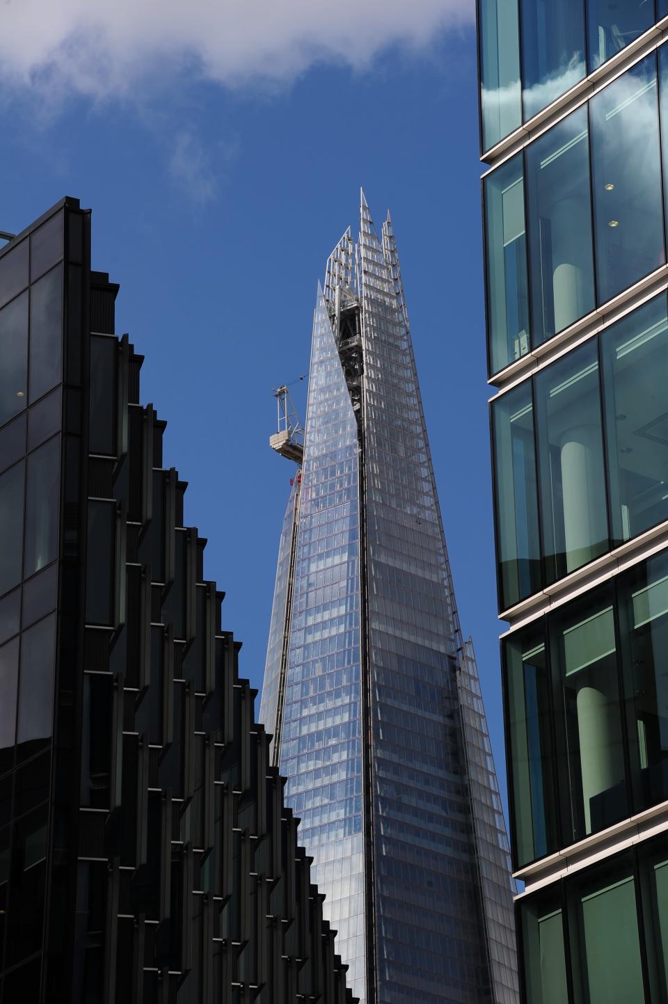 "The elongated glass pyramid, built atop a train station in a scruffy neighbourhood near the Thames, will open with 26 floors of vacant office space, and developers have to fill it at a time when rents are at the flattest in at least 50 years," newswire Reuters reported. (AFP PHOTO/MIGUEL MEDINA)