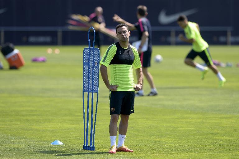 Barcelona's Xavi Hernandez takes part in a training session during the 'Open Media Day', at the Sports Center FC Barcelona Joan Gamper in Sant Joan Despi, on June 2, 2015