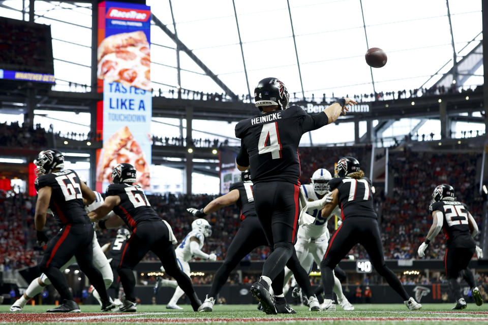 Atlanta Falcons quarterback Taylor Heinicke (4) passes in his own end zone against the Indianapolis Colts during the first half of an NFL football game, Sunday, Dec. 24, 2023, in Atlanta. (AP Photo/Alex Slitz)