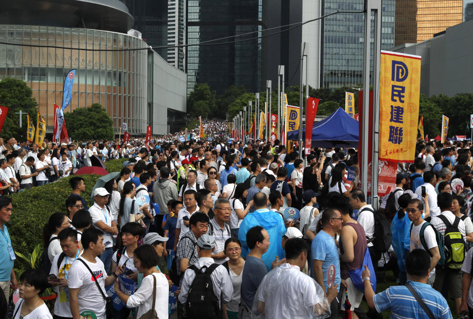 Pro-China supporters gather at a park during a counter-rally in support of the police in Hong Kong Saturday, July 20, 2019. Police in Hong Kong have raided a homemade-explosives manufacturing lab ahead of another weekend of protests in the semi-autonomous Chinese territory. (AP Photo/Vincent Yu)