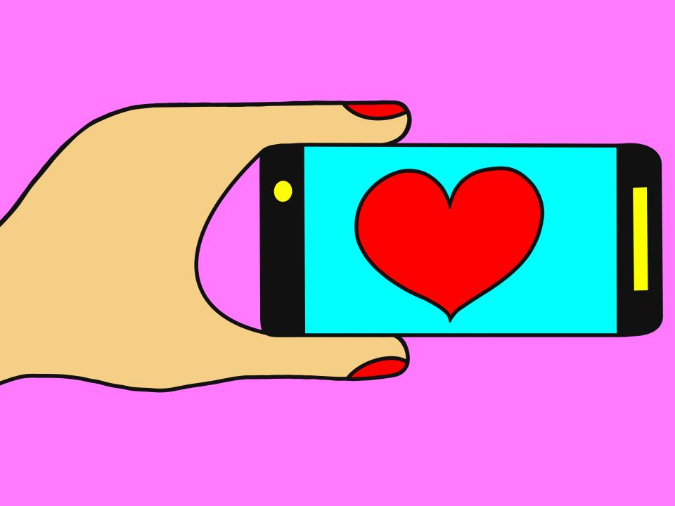 an animated hand holding a phone with a giant red heart displayed on the screen