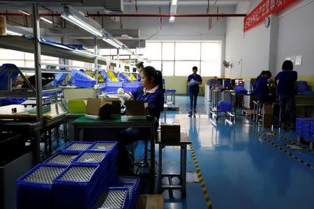 Batteries for electric vehicles are manufactured at a factory in Dongguan, China September 20, 2017. REUTERS/Bobby Yip