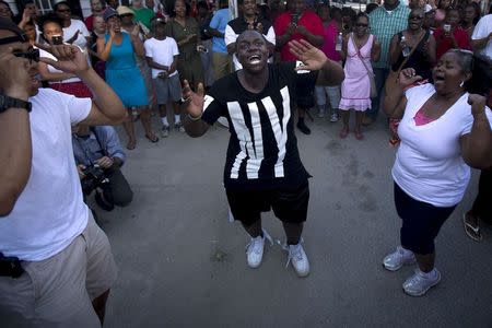 People take part in "Black Lives Matter" march around Emanuel African Methodist Episcopal Church in Charleston, June 20, 2015. REUTERS/Carlo Allegri