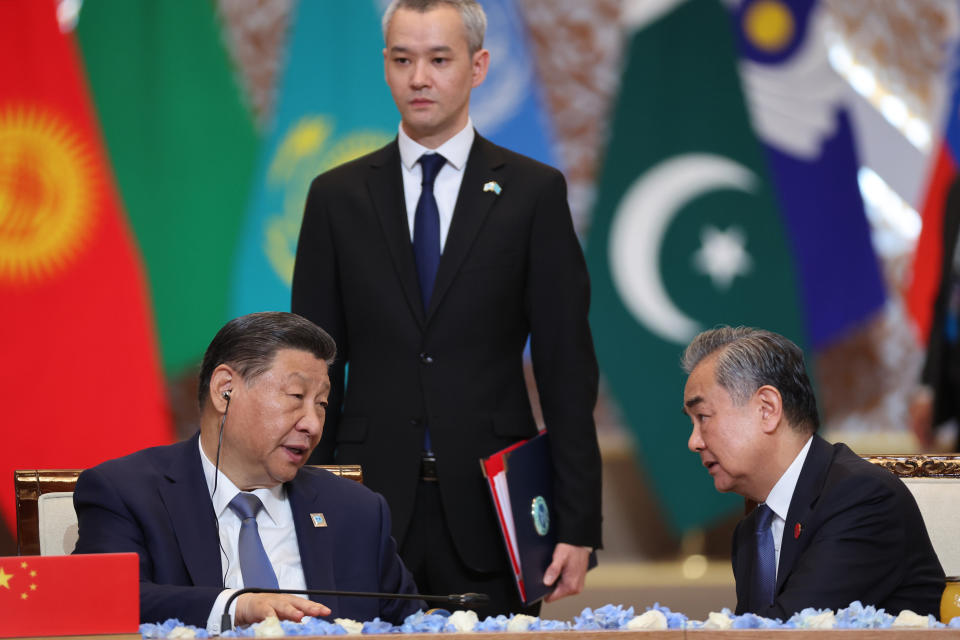 Chinese President Xi Jinping, left and Chinese Foreign Minister Wang Yi attend the Shanghai Cooperation Organisation (SCO) summit in Astana, Kazakhstan, Thursday, July 4, 2024. (Sergey Savostyanov, Kremlin Pool Photo via AP)