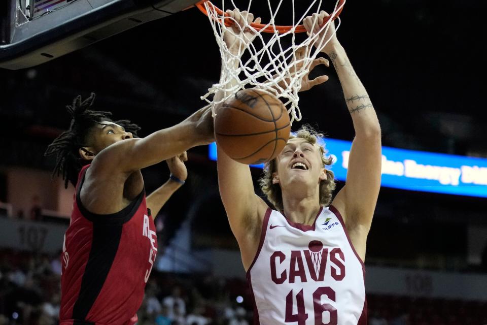 Cleveland Cavaliers forward Luke Travers, right, dunks against Houston Rockets' Jermaine Samuels Jr. during the first half of the NBA summer league championship game July 17 in Las Vegas.