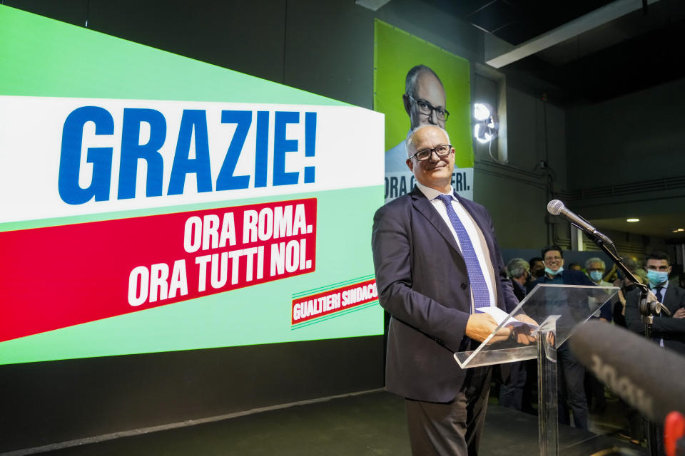 Center-left mayoral candidate Roberto Gualtieri prepares to speak at his party's headquarters in Rome, Monday, Oct. 18, 2021. Romans are waiting to learn who will be their next mayor, following runoff elections that ended Monday in the Italian capital. The top vote-getters in the first round of balloting two weeks earlier, Enrico Michetti, a novice politician backed by a far-right leader, and Roberto Gualtieri, a Democrat and former finance minister, competed in the runoff Sunday and Monday. Italian writing in the background reads 'Thank you! Now Rome! Now all of us. (AP Photo/Gregorio Borgia)