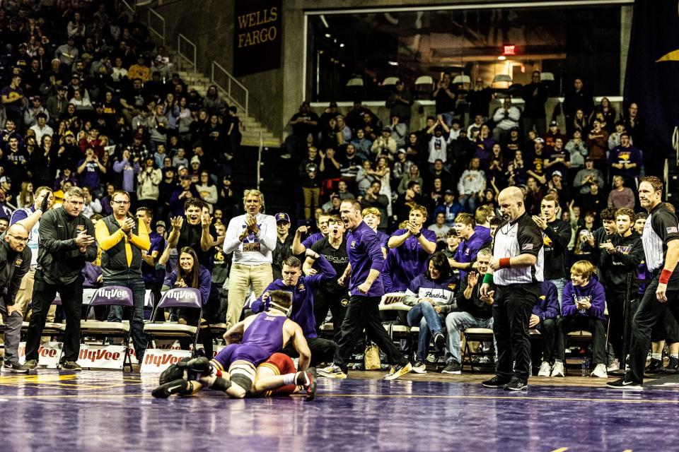 Northern Iowa's Kyle Gollhofer scores a late takedown to beat Iowa State's Ethan Perryman, 8-6, at 125 pounds during the Iowa State-Northern Iowa wrestling dual on Friday night at the McLeod Center.