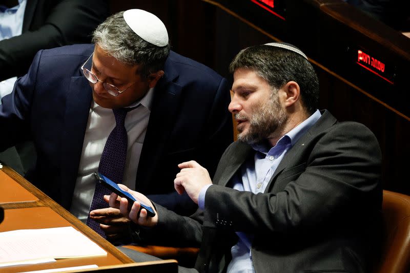 Israeli right-wing Knesset members Itamar ben Gvir and Bezalel Smotrich attend a session at the plenum at the Knesset, Israel's parliament in Jerusalem