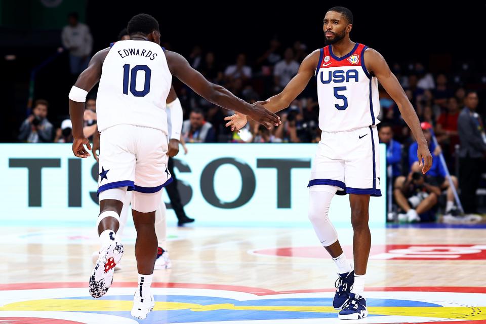 Anthony Edwards #10 (L) and Mikal Bridges #5 of the United States celebrate after a play in the fourth quarter during the FIBA Basketball World Cup 2nd Round Group J game against Montenegro at Mall of Asia Arena on Sept. 1, 2023, in Manila, Philippines.