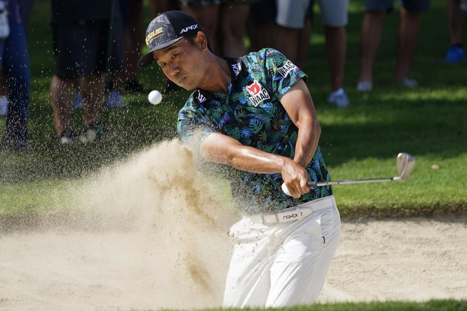 Kevin Na hits out of the ninth bunker during the second round of the Sony Open golf tournament, Friday, Jan. 14, 2022, at Waialae Country Club in Honolulu. (AP Photo/Matt York)