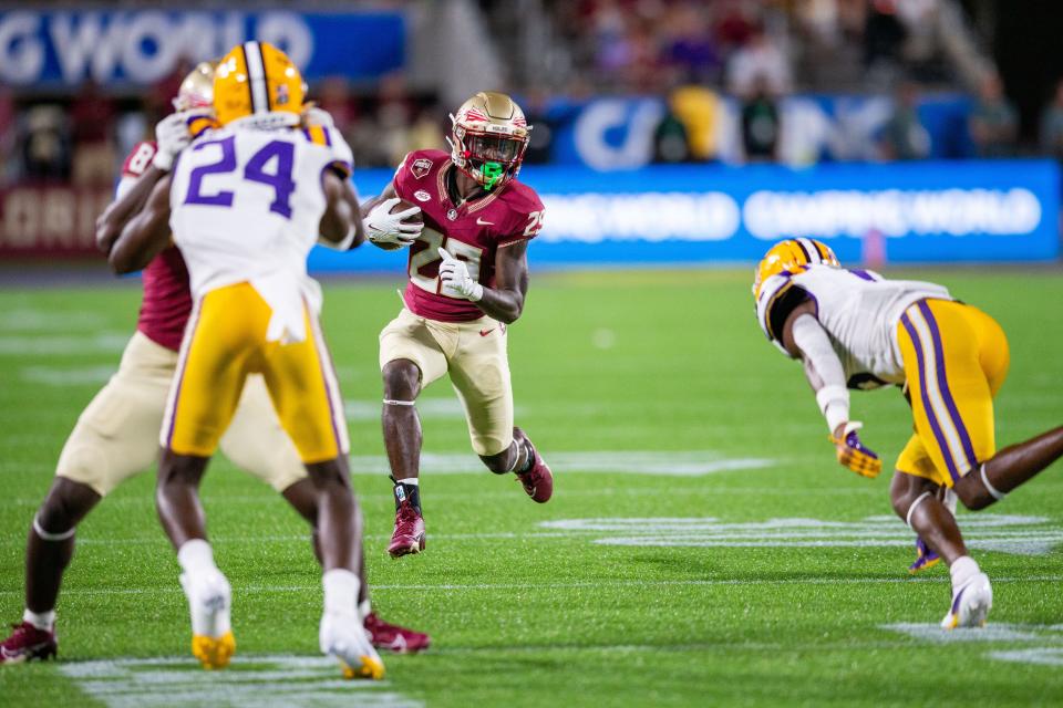 Florida State Seminoles running back Rodney Hill (29) dodges defenders as he makes his way down the field on Sunday, Sept. 3, 2023.
