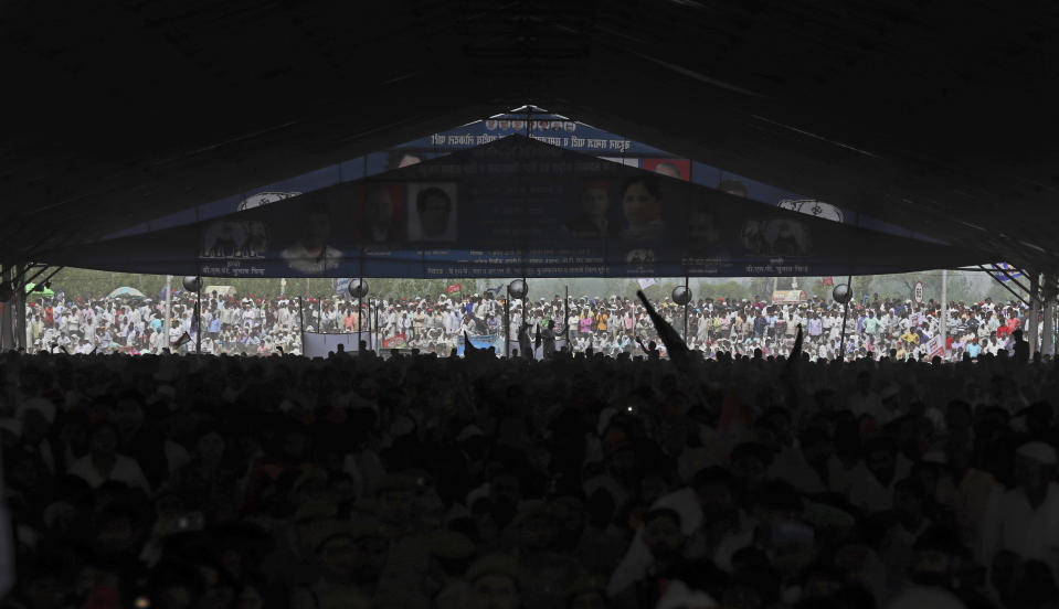 FILE - In this April 7, 2019 file photo, supporters of Bahujan Samaj Party (BSP), Samajwadi Party (SP) and Rashtriya Lok Dal (RLD) gather during an election rally in Deoband, Uttar Pradesh, India. The final phase of India’s marathon general election will be held on Sunday, May 19. The first of the election’s seven staggered phases was held on April 11. Vote counting is scheduled to start on May 23. India has 900 million eligible voters. (AP Photo/Altaf Qadri, File)