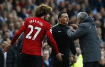 Britain Soccer Football - Manchester City v Manchester United - Premier League - Etihad Stadium - 27/4/17 Manchester United's Marouane Fellaini after being sent off with manager Jose Mourinho and fourth official Neil Swarbrick Action Images via Reuters / Jason Cairnduff Livepic