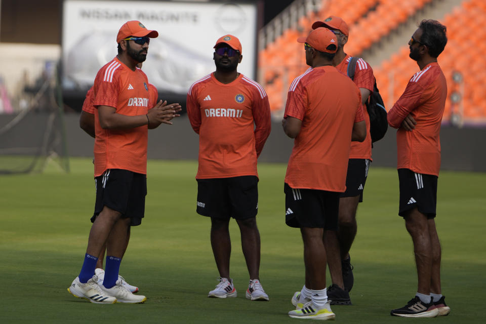 Indian cricket captain Rohit Sharma, left, speaks during a practice session ahead of the ICC Men's Cricket World Cup final match against Australia in Ahmedabad, India, Friday, Nov. 17, 2023. (AP Photo/Ajit Solanki)