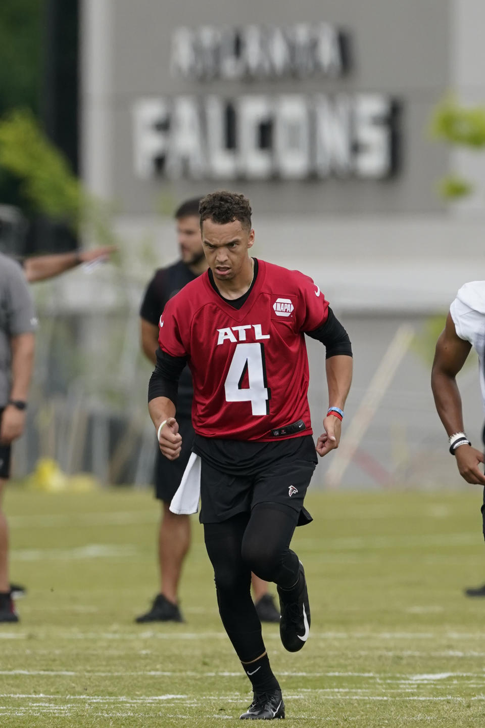 Atlanta Falcons rookie quarterback Desmond Ridder runs during their NFL rookie minicamp football practice Friday, May 13, 2022, in Flowery Branch, Ga. (AP Photo/John Bazemore)