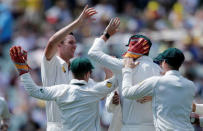 Cricket - Australia v South Africa - Third Test cricket match - Adelaide Oval, Adelaide, Australia - 24/11/16. Australian bowler Josh Hazlewood (L) celebrates the dismissal of South Africa's Hashim Amla during the first day of the Third Test cricket match in Adelaide. REUTERS/Jason Reed