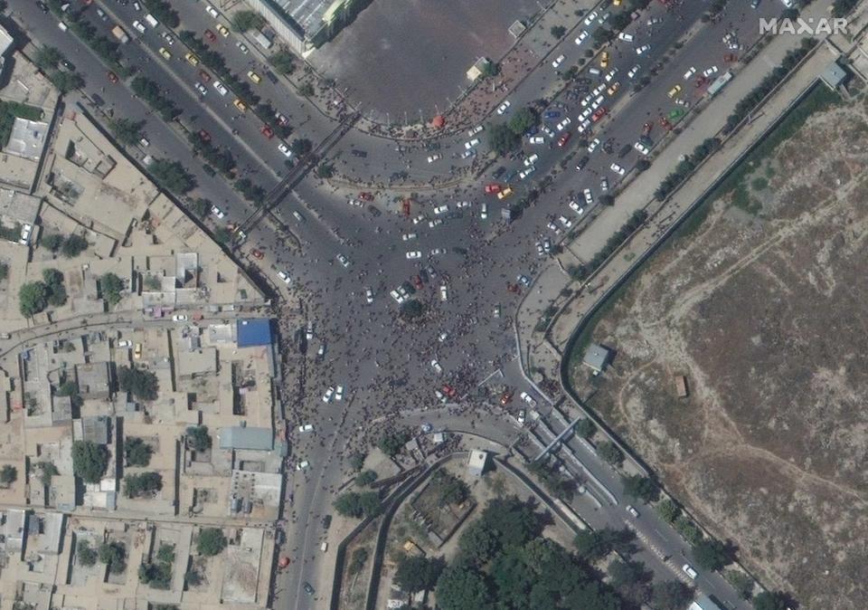 A satellite image released by Maxar Technologies shows crowds near the entrance to Kabul's international airport on Aug. 16, 2021.