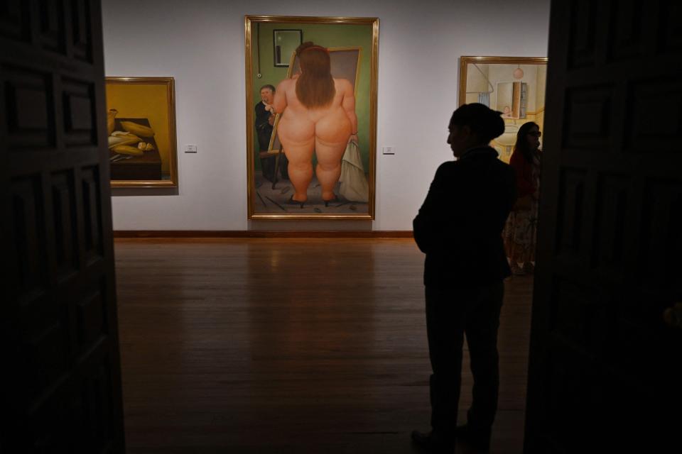 A security agent guards the El Estudio painting by Colombian artist Fernando Botero at the Botero Museum in Bogota on Sept. 15, 2023.