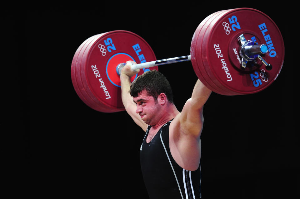 LONDON, ENGLAND - AUGUST 04: Saeid Mohammadpourkarkaragh of Iran competes in the Men's 94kg Weightlifting final on Day 8 of the London 2012 Olympic Games at ExCeL on August 4, 2012 in London, England. (Photo by Mike Hewitt/Getty Images)