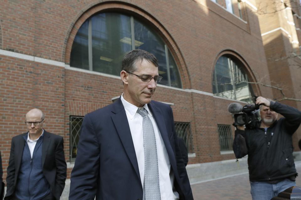 Michael Center, former men's tennis coach at the University of Texas at Austin, leaves federal court in Boston, Monday, Feb. 24, 2020, after being sentenced in a nationwide college admissions bribery scandal. (AP Photo/Steven Senne)