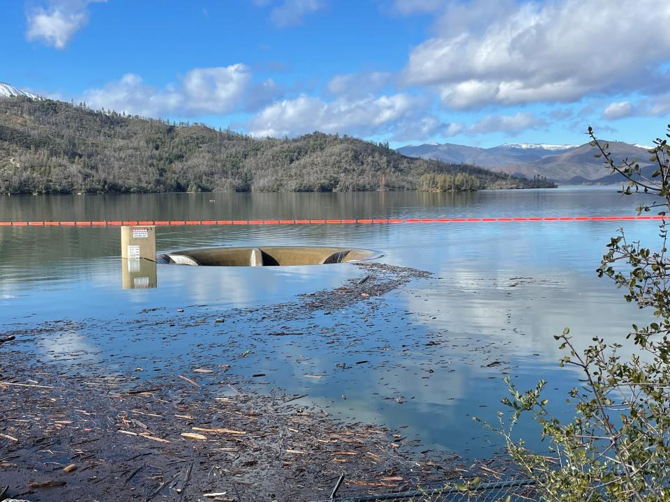 Excess water flows down the Glory Hole in Whiskeytown Lake overflows on Monday, Jan. 9, 2023. The spillway prevents water from going over the top of Whiskeytown Dam. It is routed under the dam where it flows into Clear Creek. The last time the area had an overflow was in 2019. It also happened in 2017.