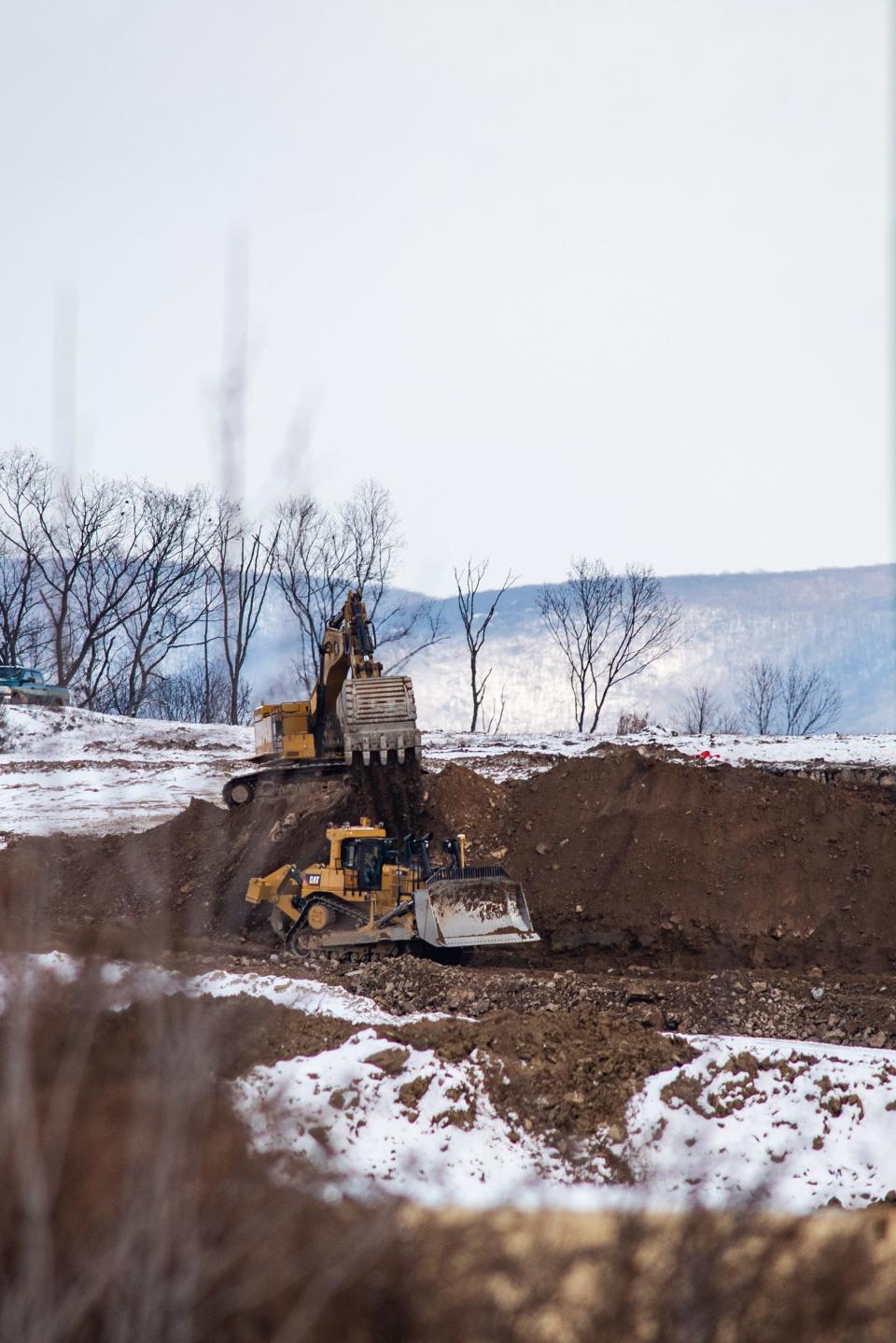 Construction vehicles work at a construction site on Route 300 in Newburgh, NY on Friday, January 7, 2022.