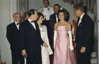 <p>The First Lady commands the room in a strapless silk gown, evening gloves, and a glittering hairpiece at a state dinner in honor of the Minister of State for Cultural Affairs of France. <br></p>