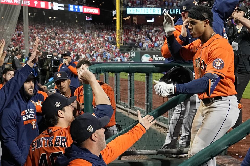 Houston Astros' Jeremy Pena celebrates in the dugout after a home run during the fourth inning in Game 5 of baseball's World Series between the Houston Astros and the Philadelphia Phillies on Thursday, Nov. 3, 2022, in Philadelphia. (AP Photo/Matt Slocum)