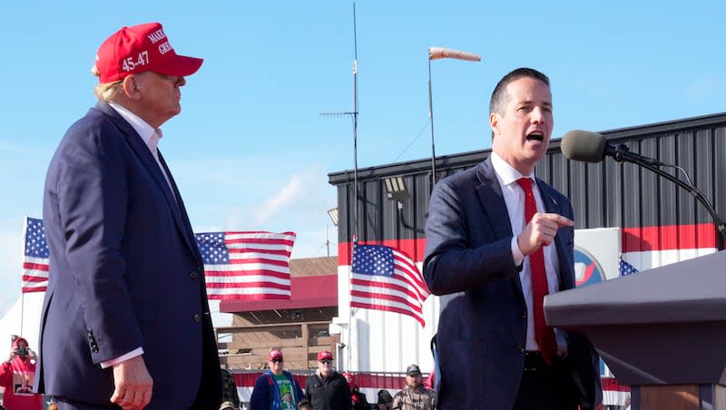 Republican presidential candidate and former President Donald Trump, left, listens as Senate candidate Bernie Moreno speaks at a campaign rally March 16, 2024, in Vandalia, Ohio. Five states will hold presidential primaries on Tuesday, March 19, as President Joe Biden and Trump continue to lock up support around the country after becoming their parties' presumptive nominees. Ohio's Republican Senate primary pits Trump-backed Moreno against two challengers, Ohio Secretary of State Frank LaRose and Matt Dolan, whose family owns the Cleveland Guardians baseball team.