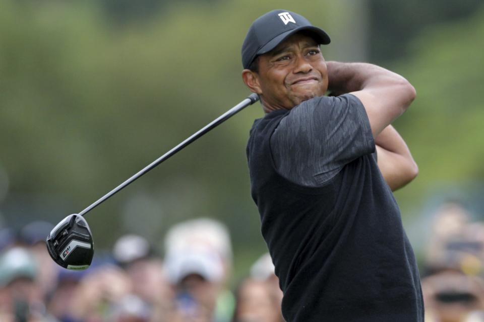 Tiger Woods tees off at the 10th hole during the third round of the BMW Championship golf tournament at Aronimink in Newtown Square, Pa., Saturday, Sept. 8, 2018. (Charles Fox/The Philadelphia Inquirer via AP)