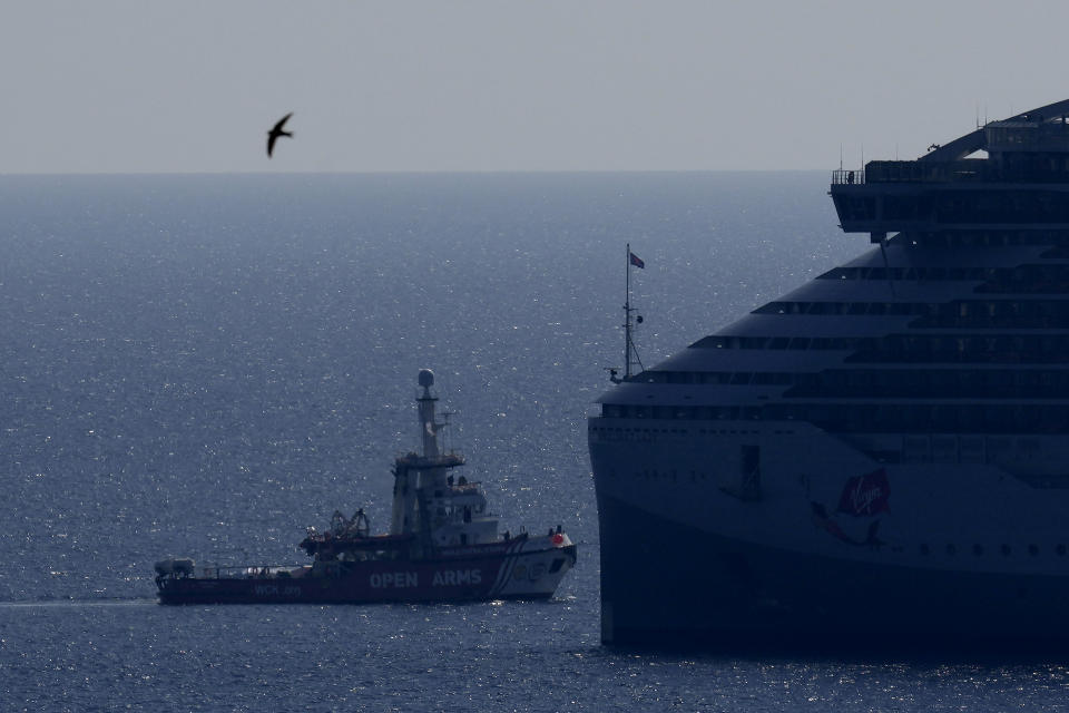 The ship belonging to the Open Arms aid group with aid on a platform ferry some 200 tonnes of rice and flour directly to Gaza, departs from the port of southern city of Larnaca, Cyprus, Tuesday, March 12, 2024. An aid ship loaded with some 200 tons of food set sail Tuesday from Cyprus to Gaza, the international charity behind the effort said. The shipment is a test for the opening of a sea corridor to supply aid to the territory, where starvation is spreading five months into the Israel-Hamas war. (AP Photo/Petros Karadjias)